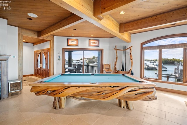 playroom with pool table, wood ceiling, light tile patterned flooring, and a water view