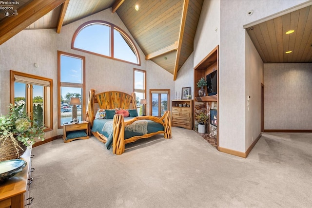 bedroom featuring light carpet, beam ceiling, and high vaulted ceiling