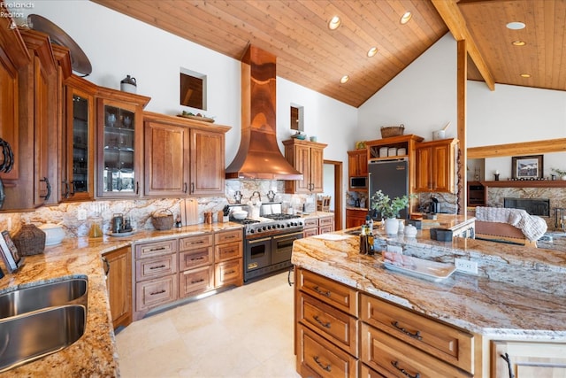 kitchen with wood ceiling, light stone counters, high vaulted ceiling, custom range hood, and stainless steel appliances