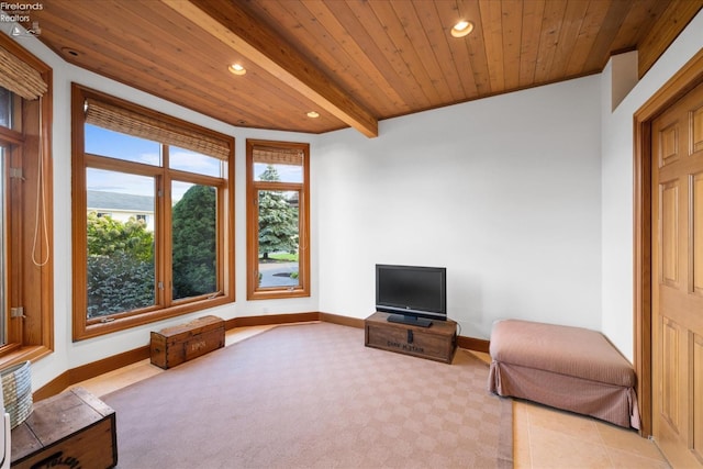 sitting room featuring light tile patterned floors, wooden ceiling, and beamed ceiling