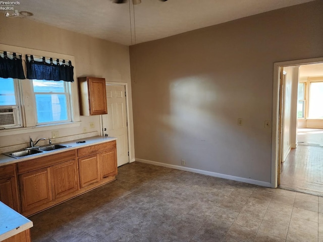 kitchen with sink, cooling unit, and ceiling fan