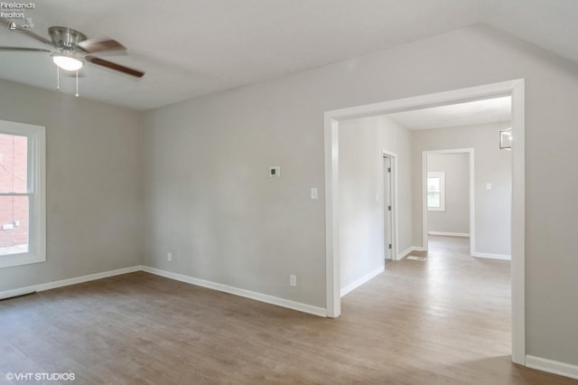 unfurnished room featuring light hardwood / wood-style floors and ceiling fan