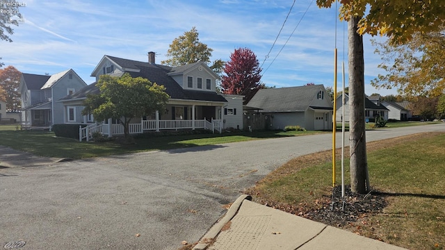 view of front facade featuring a front lawn and a porch