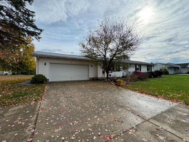 ranch-style house with a front lawn and a garage