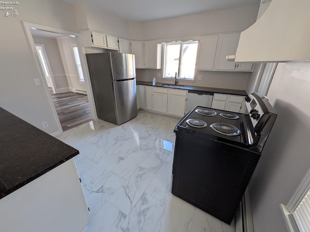 kitchen featuring white cabinets, stainless steel appliances, sink, and a baseboard heating unit