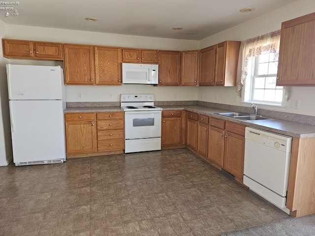 kitchen with sink and white appliances