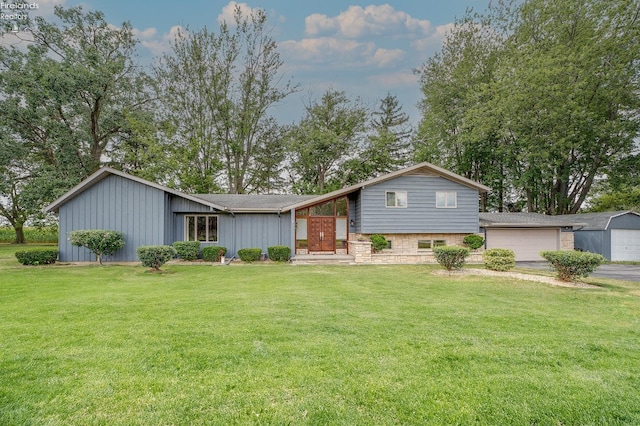 tri-level home with a garage and a front lawn