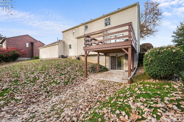 back of property featuring cooling unit and a patio