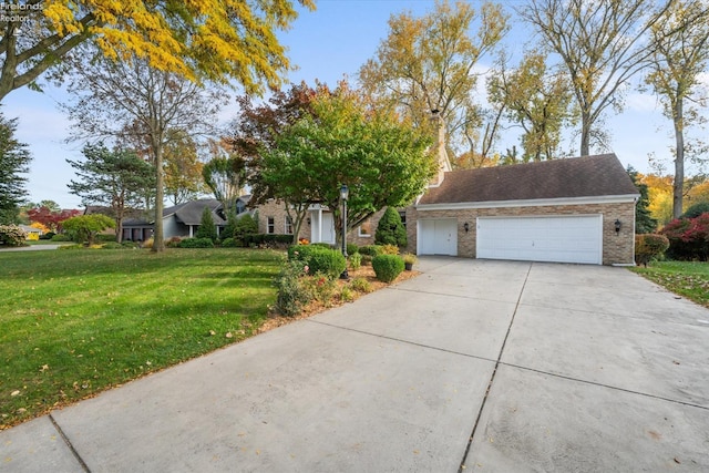 view of front of house featuring a front lawn and a garage