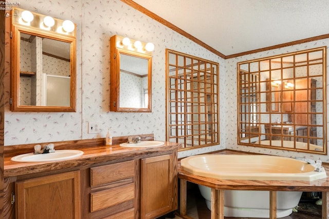 bathroom with a textured ceiling, shower with separate bathtub, lofted ceiling, and ornamental molding