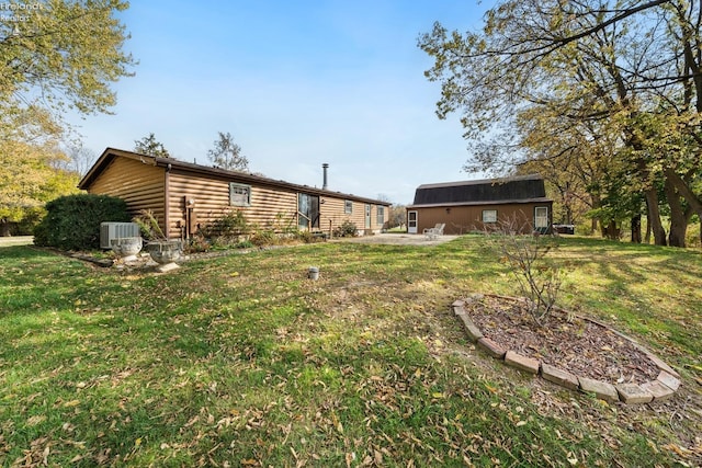 view of yard with central AC unit