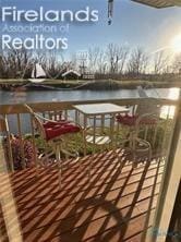 balcony featuring a water view