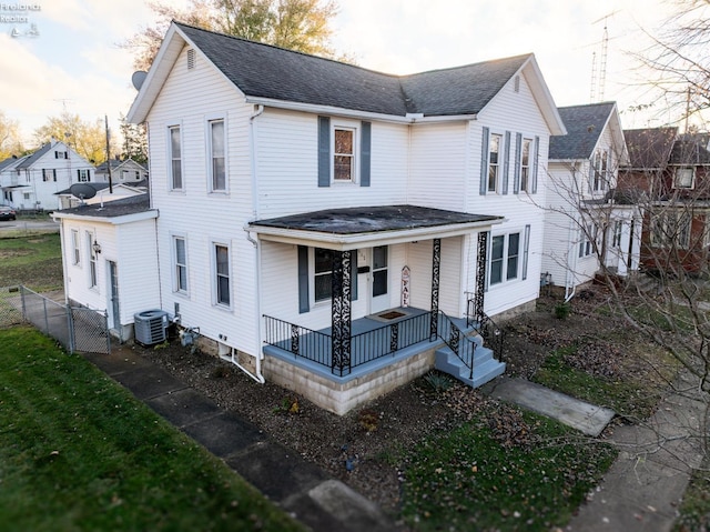 view of front of house featuring central AC unit and a porch