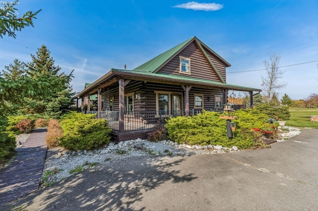 log-style house with a porch