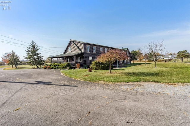 14136 Township Rd Unit 108, Findlay, OH 45840 - view of front facade featuring driveway and a front yard