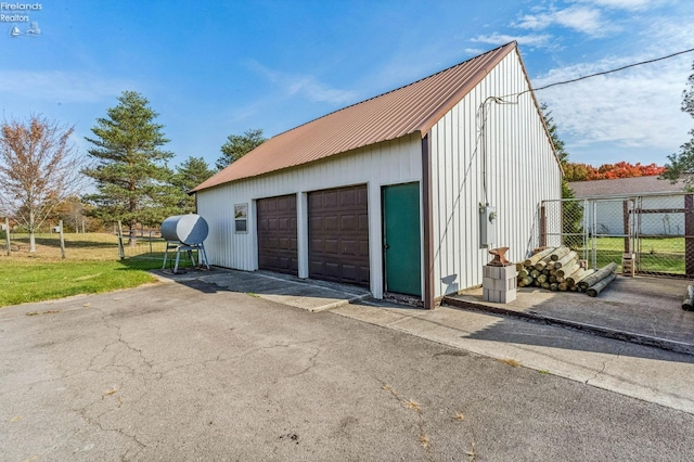 garage with a yard