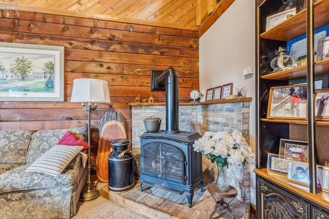 room details featuring wood ceiling and a wood stove