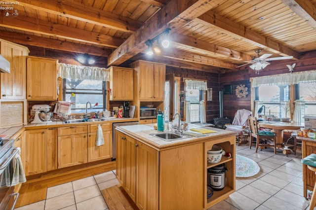 14136 Township Rd Unit 108, Findlay, OH 45840 - kitchen featuring tile counters, a sink, and a wood stove