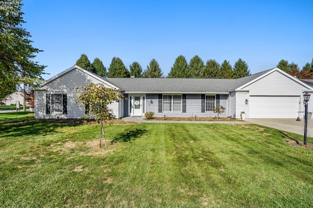 single story home featuring a garage and a front yard