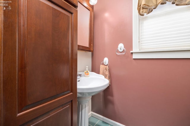 bathroom featuring sink and tile patterned flooring