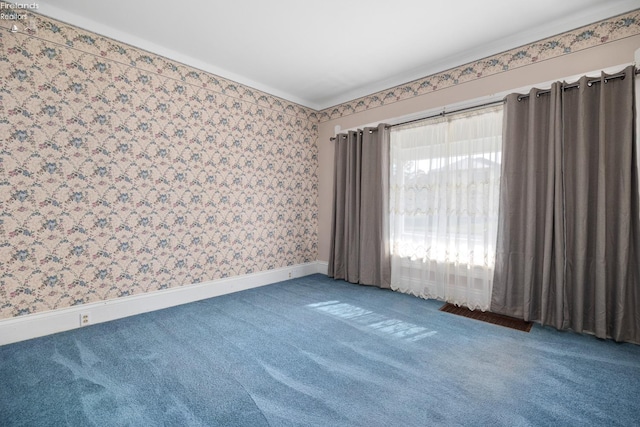 spare room featuring carpet