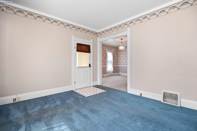 unfurnished room featuring carpet flooring