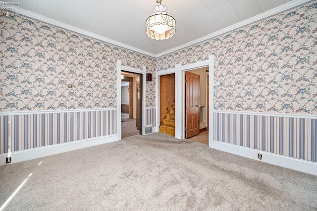 unfurnished bedroom featuring crown molding and light colored carpet