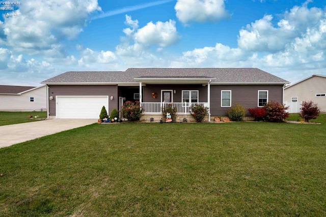 ranch-style home featuring covered porch, a garage, and a front lawn