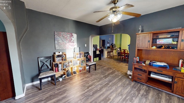 interior space featuring ceiling fan and dark hardwood / wood-style flooring