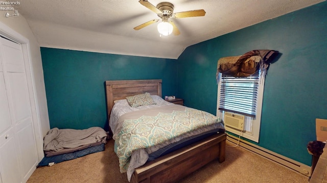 bedroom featuring ceiling fan, carpet flooring, a closet, and vaulted ceiling