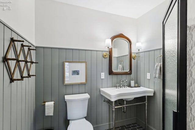 25 Edison, Milan, OH 44846 - bathroom featuring a wainscoted wall and toilet