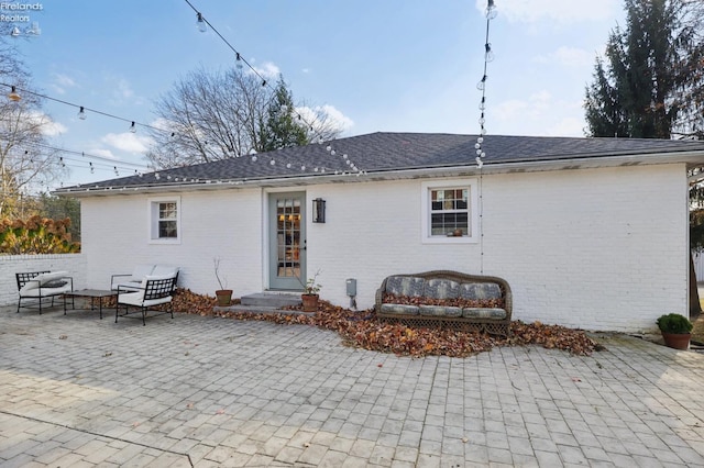 25 Edison, Milan, OH 44846 - rear view of property featuring a patio area and brick siding