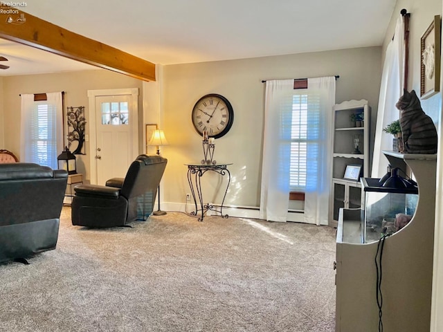 living room featuring beam ceiling, ceiling fan, carpet flooring, and plenty of natural light