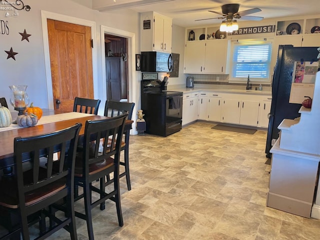 kitchen featuring tasteful backsplash, black appliances, sink, ceiling fan, and white cabinets