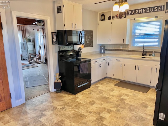 kitchen with light carpet, white cabinets, tasteful backsplash, and black appliances