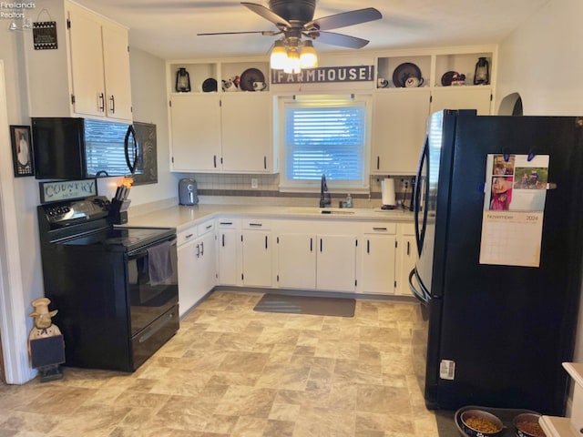 kitchen with decorative backsplash, white cabinetry, black appliances, and sink