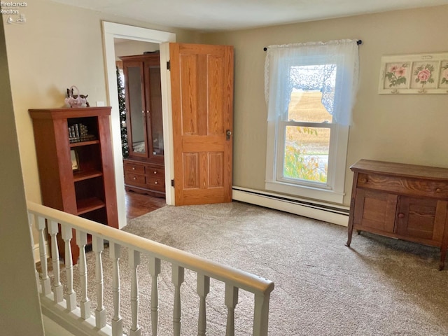 carpeted bedroom featuring a baseboard radiator