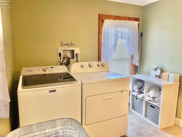 laundry room with washing machine and clothes dryer