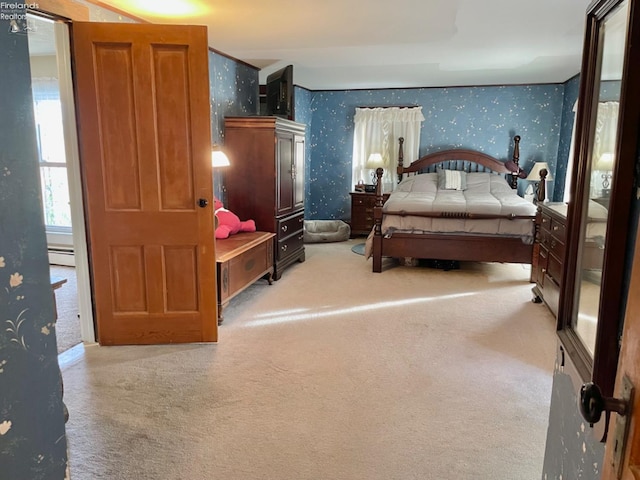 bedroom featuring carpet flooring and a baseboard heating unit