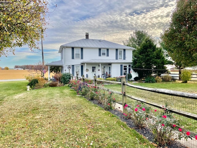 view of front of house featuring a porch and a front lawn