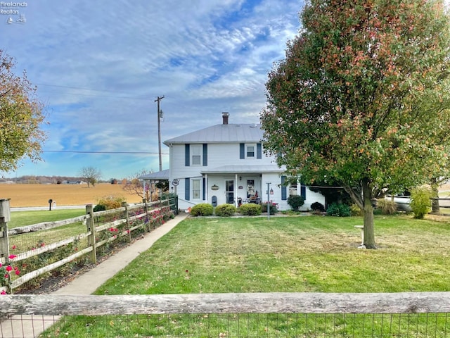 view of front of home with a front yard