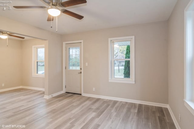 foyer with ceiling fan, light hardwood / wood-style flooring, and plenty of natural light