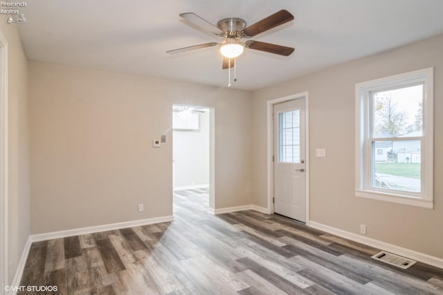 foyer entrance with hardwood / wood-style floors and ceiling fan