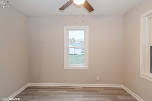 spare room featuring ceiling fan and hardwood / wood-style floors