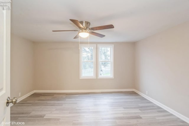 unfurnished room featuring light hardwood / wood-style flooring and ceiling fan