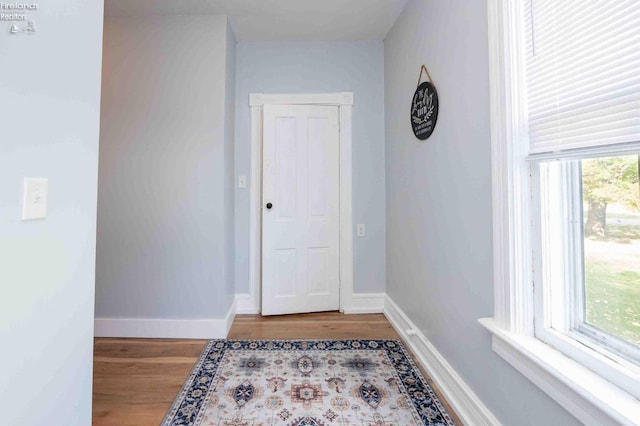 hallway featuring light wood-type flooring