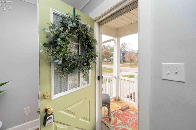 doorway with wood-type flooring