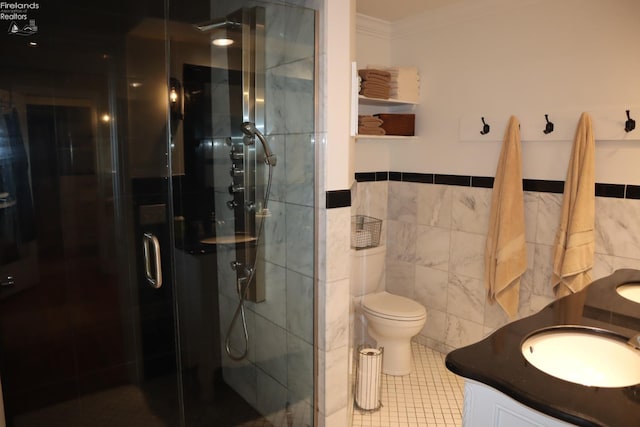 bathroom featuring toilet, tile walls, vanity, crown molding, and walk in shower