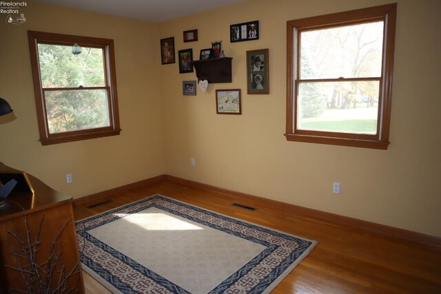 spare room featuring hardwood / wood-style flooring