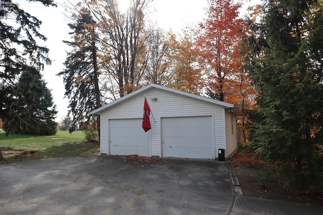 garage featuring a yard